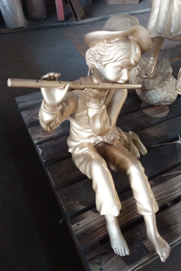 Boy & pipe statue after glass bead blasting and protective coating
